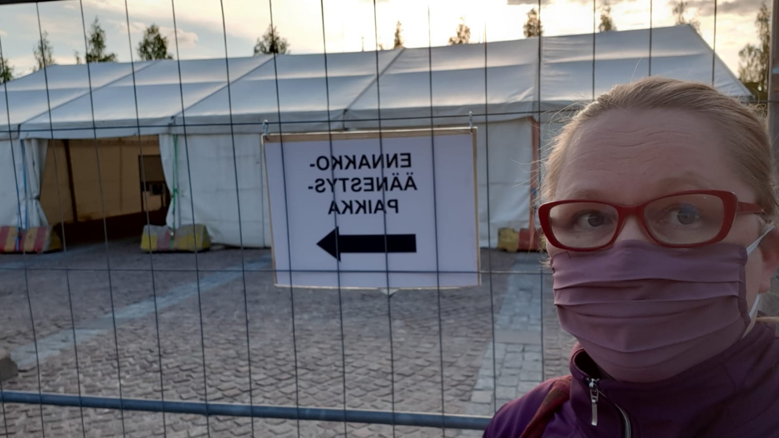 Heli with a mask in front of the voting tent.